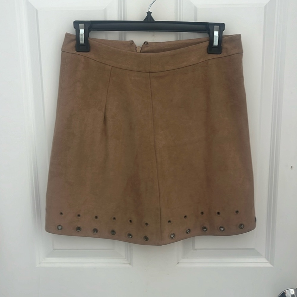 Suede tan high waisted mini skirt with bronze grommets